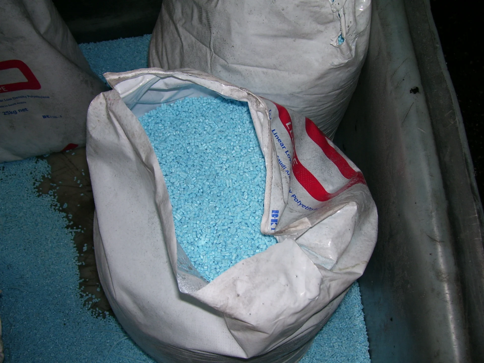 Plastic pellets for moulding; illustrative stock material, not a verified V3 product.